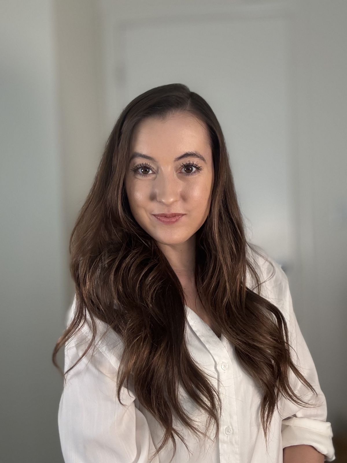 Jacquelyn in a white button-up shirt